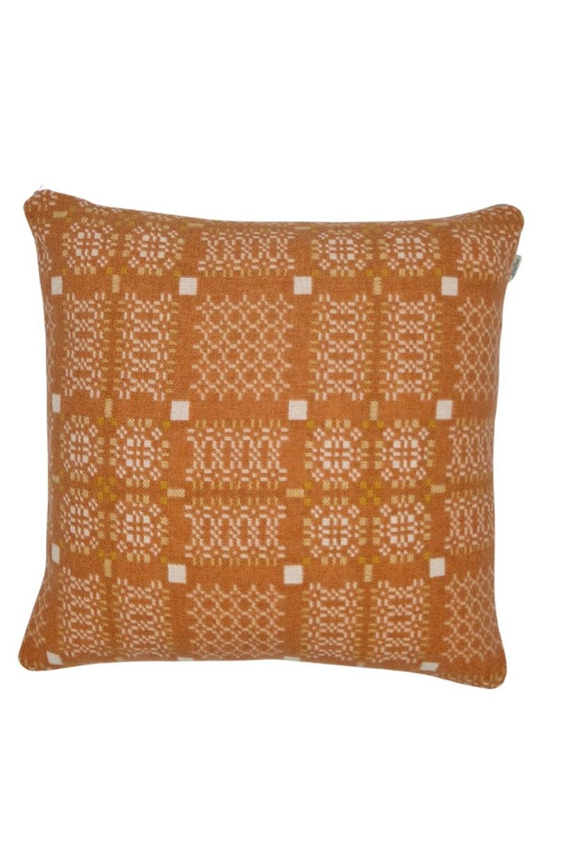 Melin Tregwynt woven wool square cushion with a orange and white woven Knot Garden pattern - Front