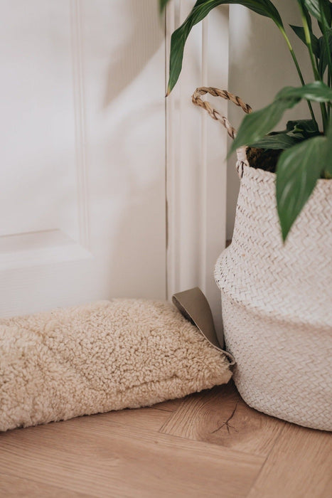 Oatmeal Sheepskin Draught Excluder, part of the Waste Less Collection.