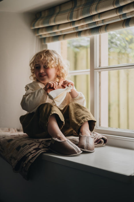 Girl Wearing Warm Slipper made from Sheepskin