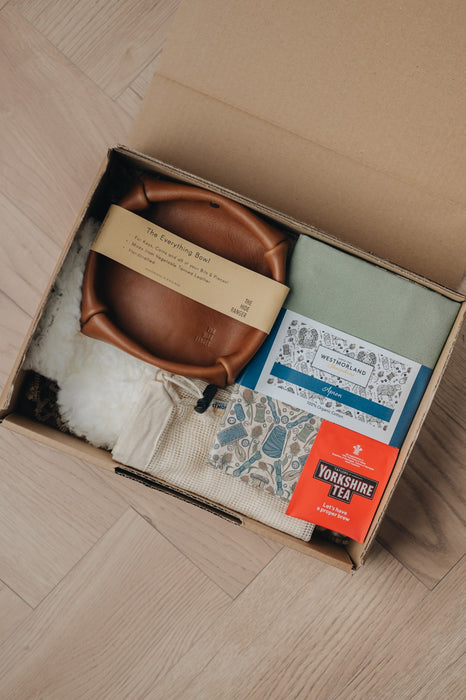 gift box with leather bowl, apron, hot water bottle and tea bag