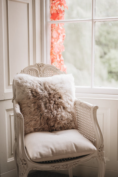 Natural Icelandic sheepskin cushion on chair 