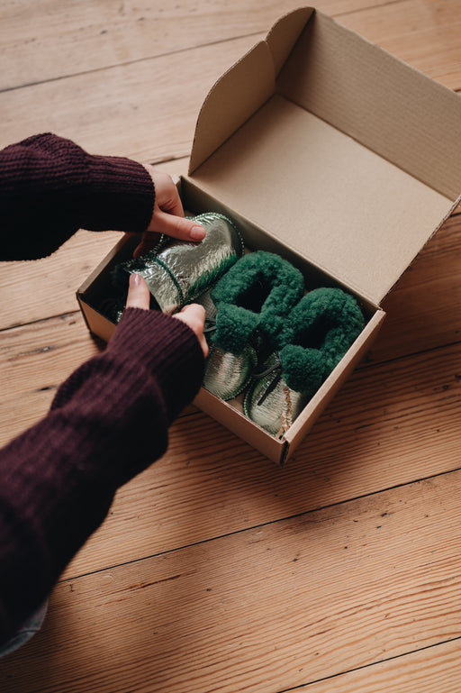 snuggle bums gift box with metallic green mittens and booties 