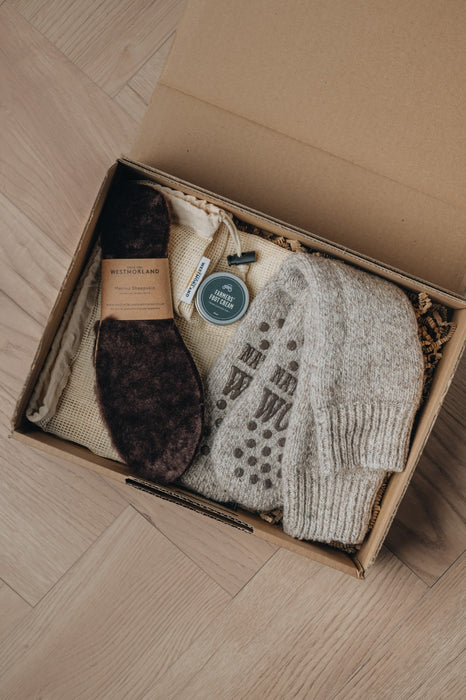 toasty toes gift box showing thick wool socks and a pair of insoles