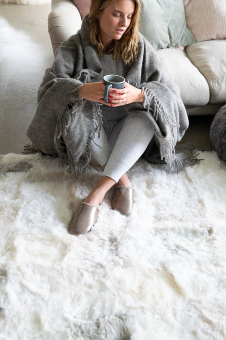 Icelandic Patchwork Sheepskin Melange Rug in a living room. Features white, beige and grey coloured patches.