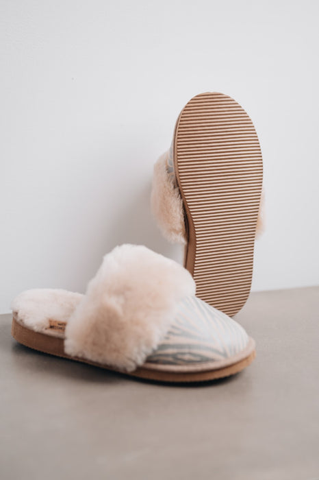 Warmest slippers for women made from sheepskin