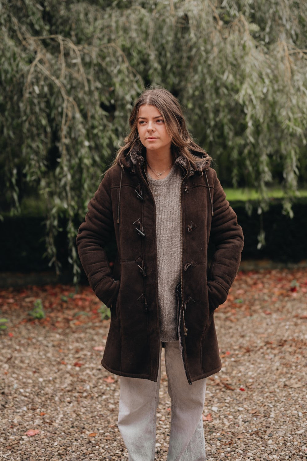 lady wearing brown sheepskin duffel coat