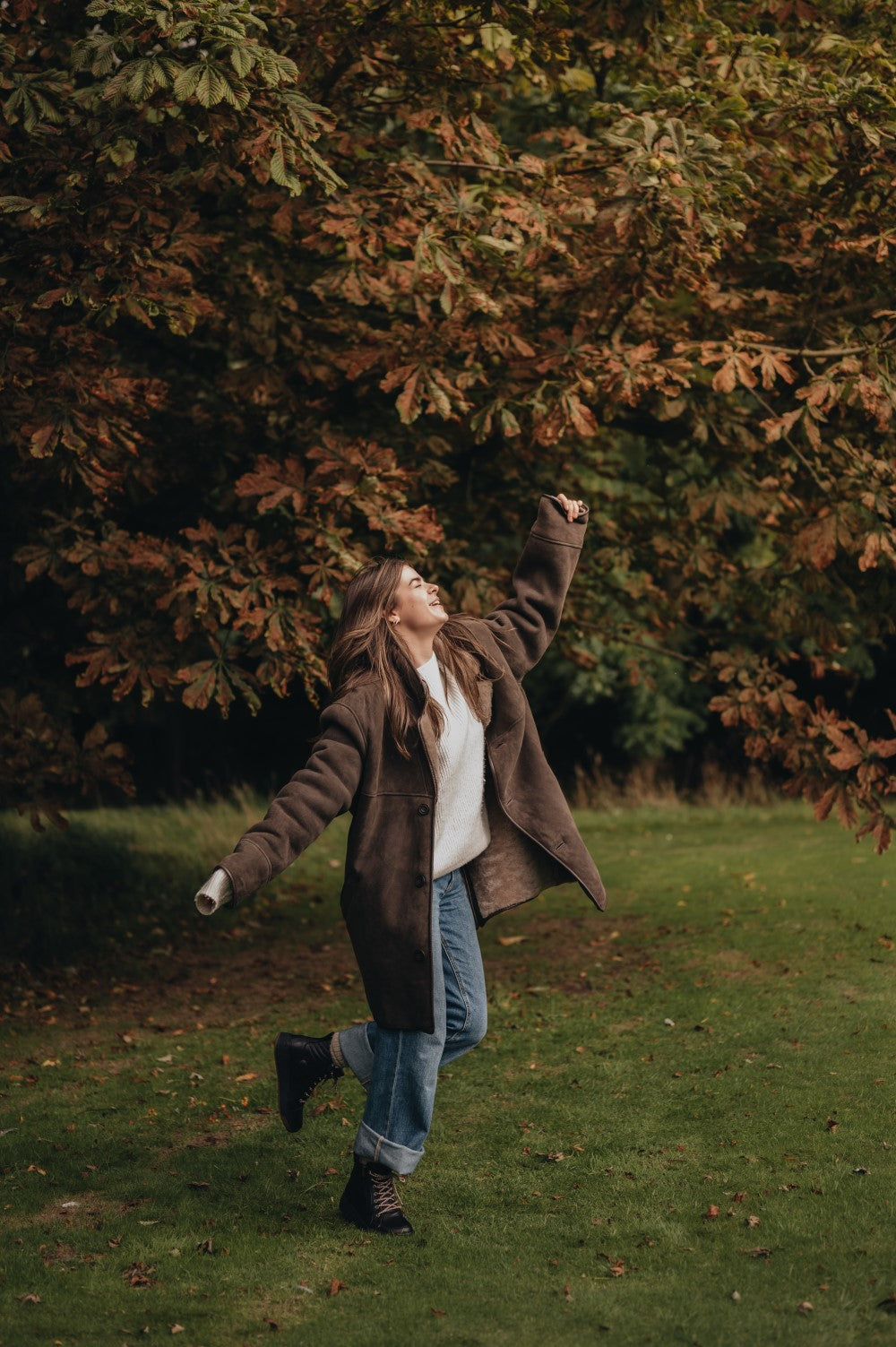 lady dancing in sheepskin coat