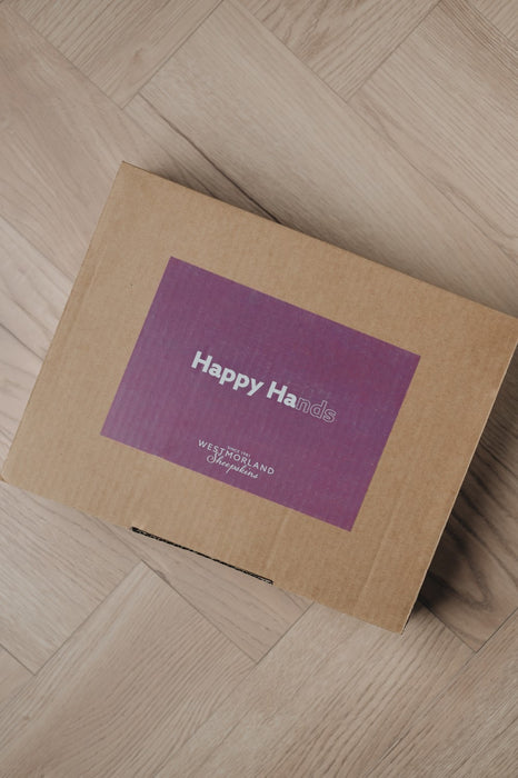 Closed box with happy hands sticker