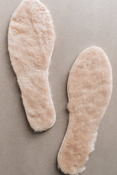 Natural colour Sheepskin Children's Cuttable Insoles. Insoles showing Sheepskin material.